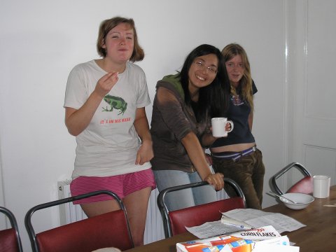 Photo of Anna, Lu and Sarah warming up on a radiator.
