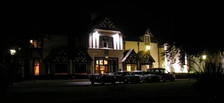 The hotel facade lit up at night